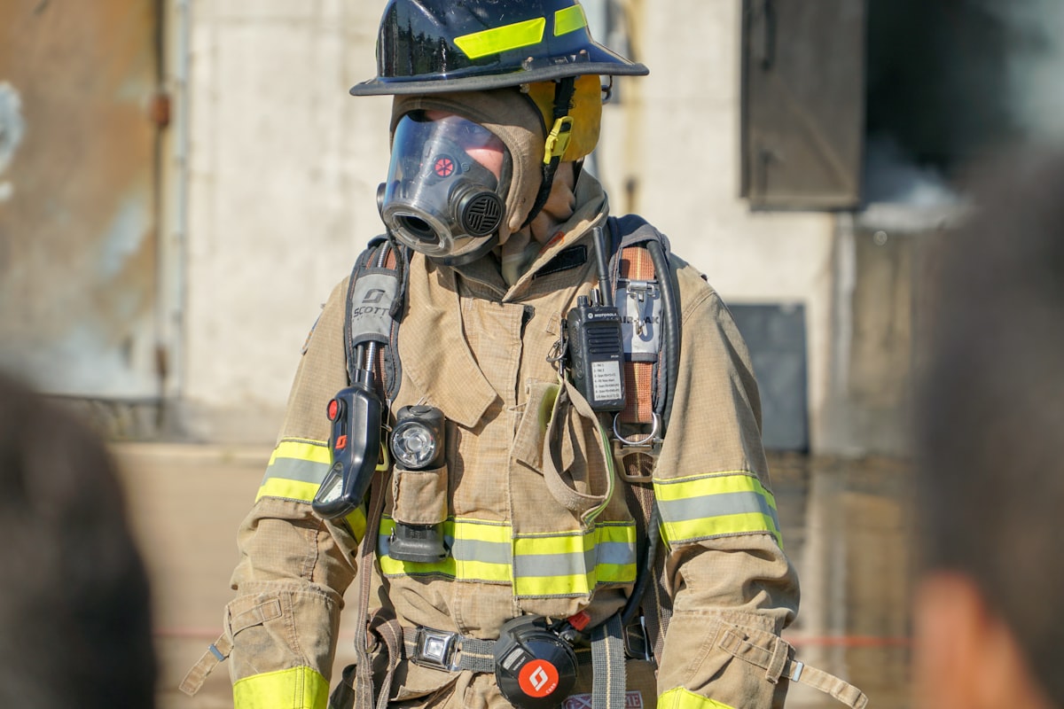 Firefighter wearing protective equipment at a work site